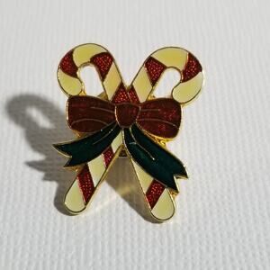 Two lapel or hat pins vintage 1978 snowman candy cane one in